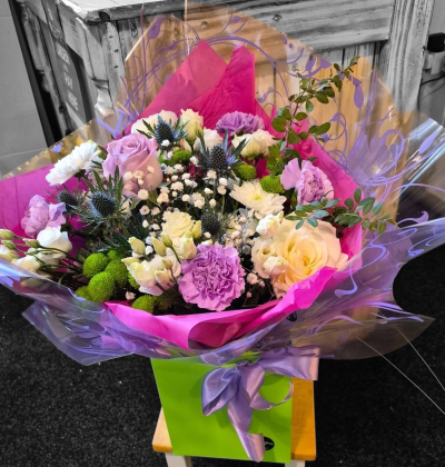 Amethyst Kiss - A stylish bouquet combining soft purples and creamy whites with fresh green accents for an elegant, contemporary finish.