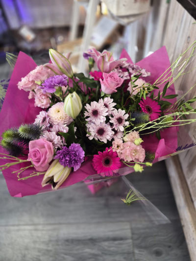 Pink Delight - A vibrant hand-tied bouquet in beautiful pink and purple tones, perfect for brightening someone’s day.