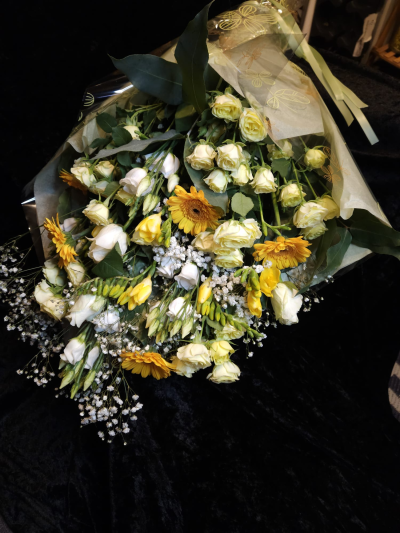 Sunshine Wishes - A cheerful bouquet in sunny yellow and soft cream shades, ideal for brightening someone’s day.
