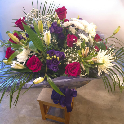 Berry Luxe - A striking bouquet in deep berry, purple and white tones for a truly impressive gift.