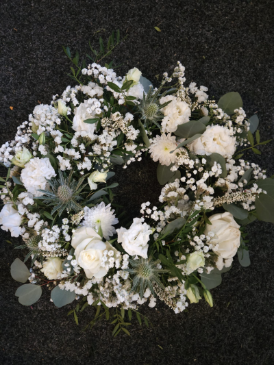 Purest Love Wreath - An elegant white wreath symbolising peace, purity and lasting devotion.