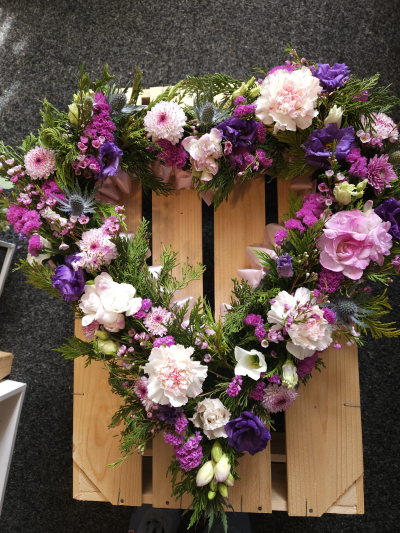 Purple Remembrance Wreath - A graceful open wreath in purple, pink and white tones, created as a loving tribute.