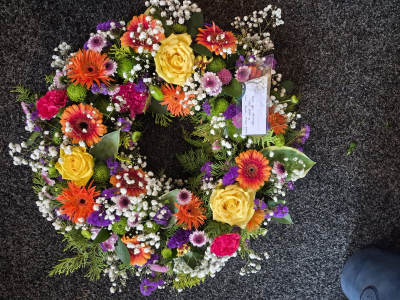 Celebration of Life Wreath - A colourful wreath in bright, uplifting shades, reflecting a life filled with warmth and joy.