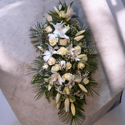 Peaceful White Spray - A timeless white funeral spray symbolising peace, purity and lasting love.
