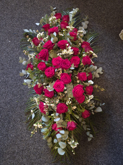 Everlasting Love Casket Spray - A rich and elegant casket arrangement offering a beautiful final farewell.